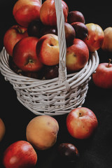 full basket of apples on a black background