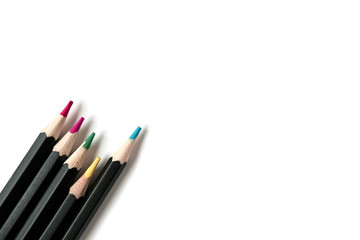 Colored wooden pencils on white isolated background