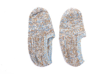 Woolen footsteps isolated on white background. Handmade knitwear.