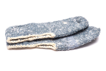 Woolen footsteps isolated on white background. Handmade knitwear.