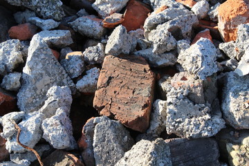 pile of broken bricks and asphalt. construction waste