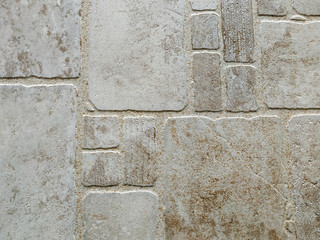Decorative modern abstract bricks or tiles for either flooring or facade made of solid rough pattern texture stone blocks