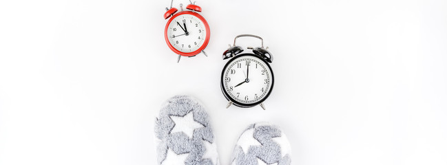Soft fluffy slippers and alarm clocks