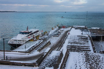 Small ferry pier in Tallinn on a frosty winter morning. Estonia