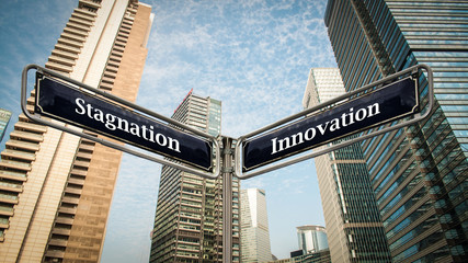 Fototapeta na wymiar Street Sign Innovation versus Stagnation