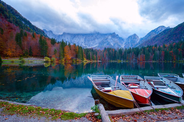 Alpine lake and colorful boats, Lake Fusine,Italy