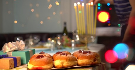Jewish Festival of Lights. Sufganiyah is a round jelly doughnut eaten in Israel and around the world on the Jewish