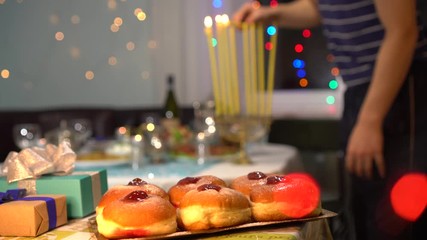 Jewish Festival of Lights. Blessings are recited when lighting the candles, which are held in a nine-branched menorah (also called a hanukkiyah)