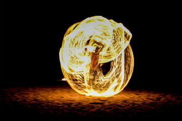 Blurry light of fire spinning at full moon night party use for web design and wallpaper background 