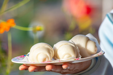 Chinese steamed bun or mantou In a plate on han.