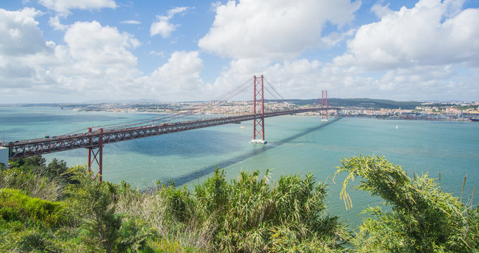 Stunning pictures of the Ponte 25 de Abril bridge - Over 2km-long, this striking Golden Gate-style bridge links Lisbon with Almada in Portugal. Have been captured from the Christ the King statue area.