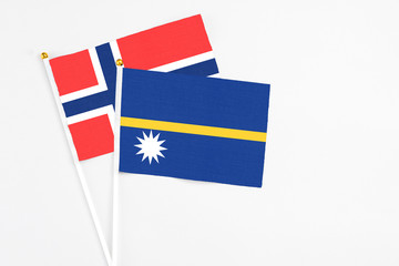 Nauru and Bouvet Islands stick flags on white background. High quality fabric, miniature national...