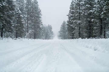 Snowy road with icy conditions.