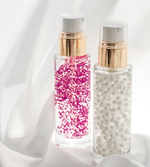 Skincare serum and make-up primer gel bottle, moisturizing lotion and lifting cream emulsion,...