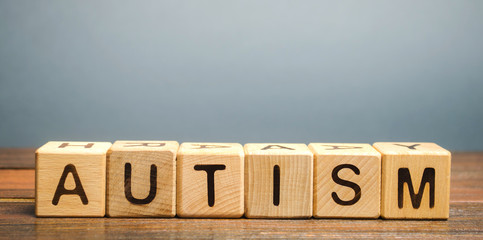 Wooden blocks with the word Autism. Neurological and developmental disorder. ASD