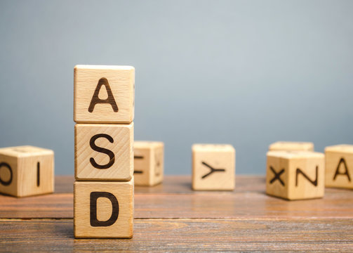 Wooden Blocks With The Word ASD - Autism Spectrum Disorder. Neurological And Developmental Disorder