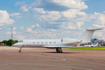 Fototapeta na wymiar Private jet on the runway. Jet airplane stop for wait VIP passenger on runway.