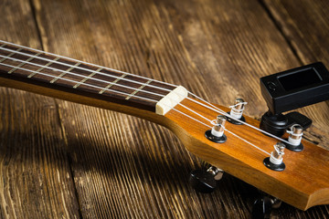 Ukulel with a reed on old boards