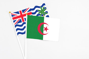 Algeria and British Indian Ocean Territory stick flags on white background. High quality fabric,...