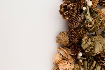 Vintage Christmas decoration. Golden Pine cones and dry leaf decoration. Logo on left