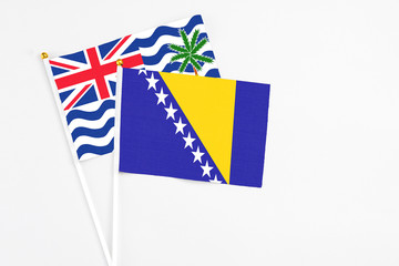 Bosnia Herzegovina and British Indian Ocean Territory stick flags on white background. High quality...