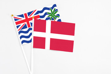 Denmark and British Indian Ocean Territory stick flags on white background. High quality fabric, miniature national flag. Peaceful global concept.White floor for copy space.