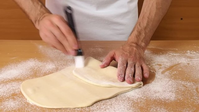 Fold dough and brush off any excess flour. Making Puff Pastry Series.
