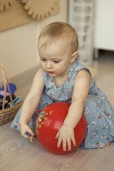 little girl playing with ball