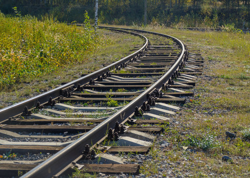 Rail transport infrastructure in Europe. Train tracks that turn left. Railroad and means of transport concept