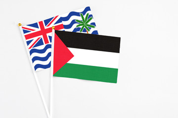 Palestine and British Indian Ocean Territory stick flags on white background. High quality fabric,...