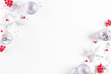 Christmas background concept. Top view of Christmas decoration, ball, star with snowflakes and red berries on white background.