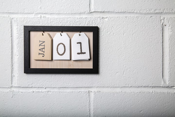 Wall Hanging Calendar in a Picture Frame Showing January 1