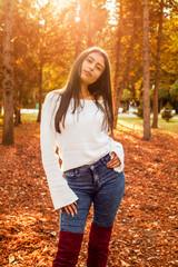 fall portrait of beauty woman holding fall leave