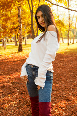 fall portrait of beauty woman holding fall leave