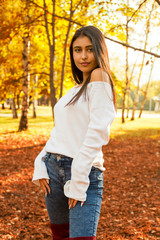 fall portrait of beauty woman holding fall leave