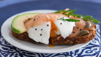 Egg sandwich with avocado and salmon