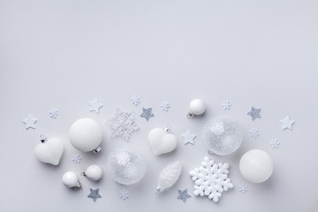Beautiful white Christmas decorations on pastel background. Christmas or New year holiday composition top view. Flat lay style.
