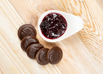 Round chocolate jaffa cake or biscuit cookie filled with natural jam