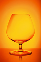 Brandy glass on a multicolored background