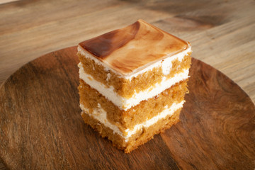 Homemade Wet Sponge Cake on Wooden Plate