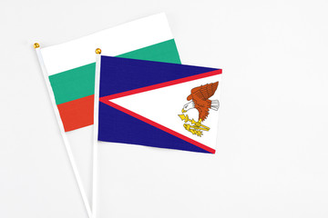 American Samoa and Bulgaria stick flags on white background. High quality fabric, miniature...