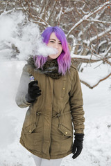 A young woman smokes VAPE.