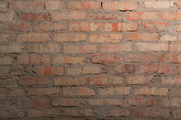 Old brown brick wall as a background, empty surface for design