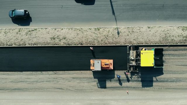 Asphalt placing carried out on the fresh road