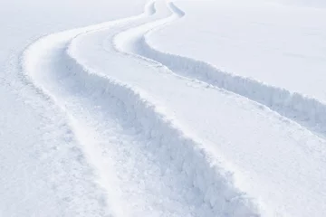Tuinposter Car tracks in the deep fresh snow © Tunatura