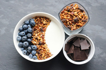 Bowl of homemade granola with yogurt and fresh berries