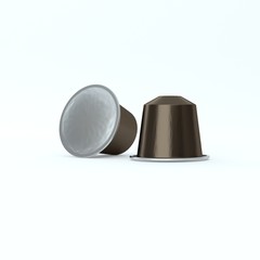 Two Brown espresso coffee capsules.