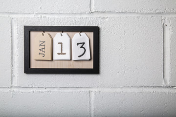 Wall Hanging Calendar in a Picture Frame Showing January 13