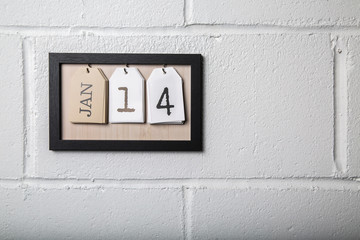 Wall Hanging Calendar in a Picture Frame Showing January 14