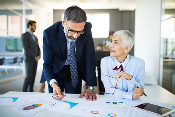 Group of architects and business people working together and brainstorming